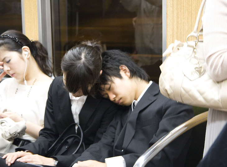 Unique Sleeping Habits From Around the World people sleeping on a train