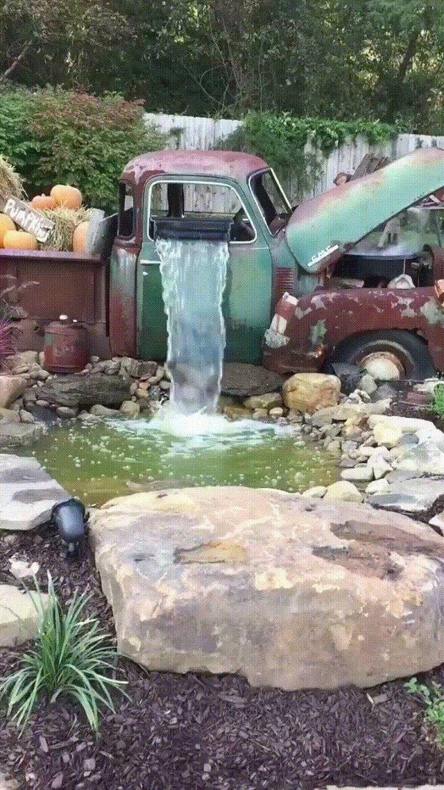 Poignant Photos old truck was incorporated into this garden waterfall
