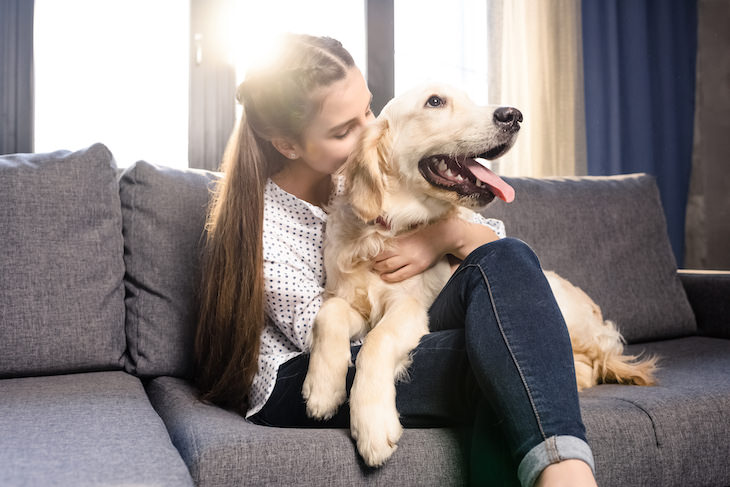 Study: The Effect of Telling Your Dog ‘I Love You' dog and girl cuddling