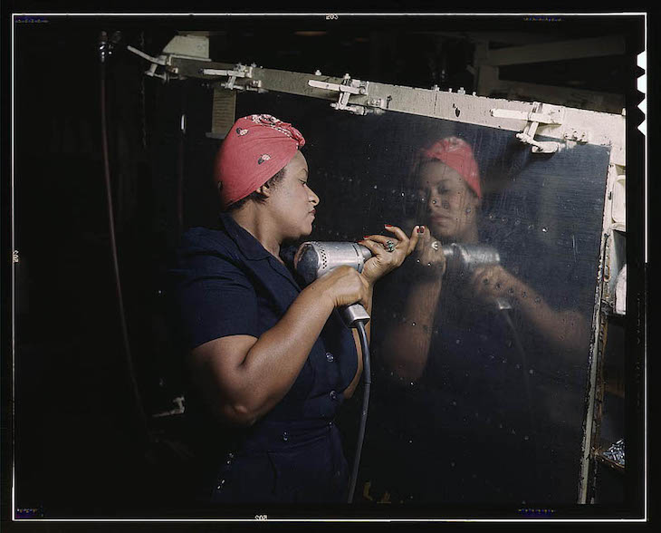 Historic Photos Depicting 1940s US in Vivid Color Woman is working on a "Vengeance" dive bomber