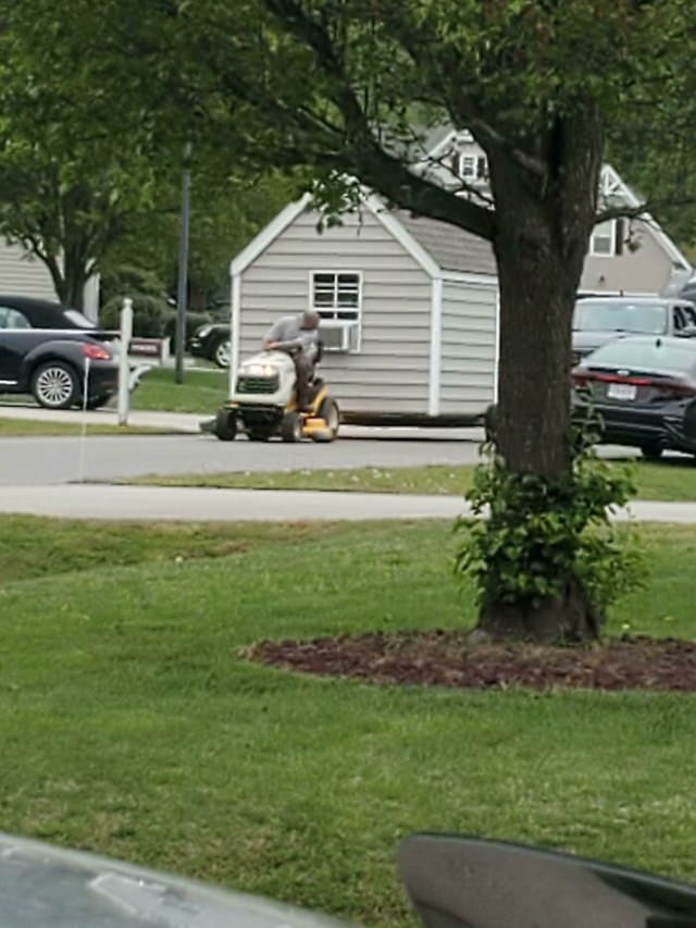 Funny Fixes towing a shed with a lawnmower
