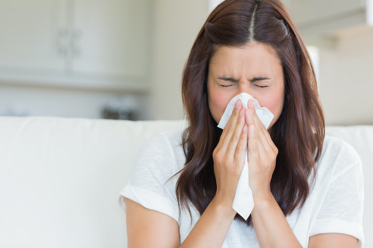 Has the Covid-19 Pandemic Affected Our Immune Systems? woman sneezing