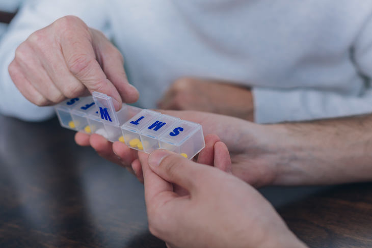 Some Common Meds May Weaken Response to COVID-19 Vaccine taking pills