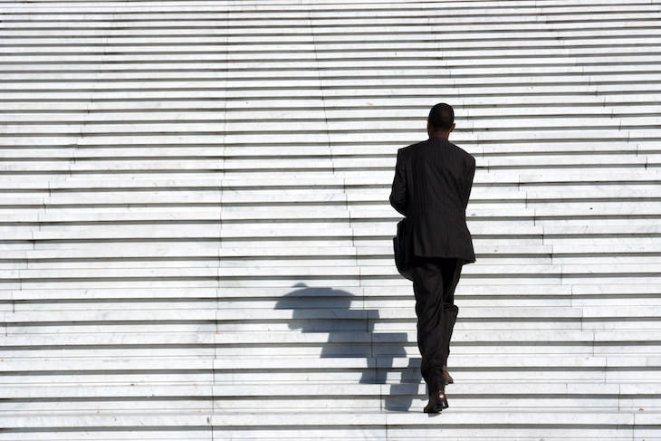 Creative Ways to Sneak More Walking Into Your Day climbing stairs