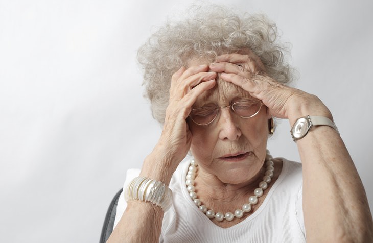 Migraine Myths older woman with headache