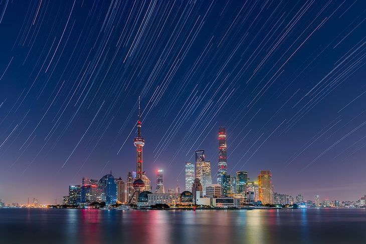 Astronomy Photographer of the Year Finalists Star Trails Over the Lujiazui City Skyline, by Daning Kai