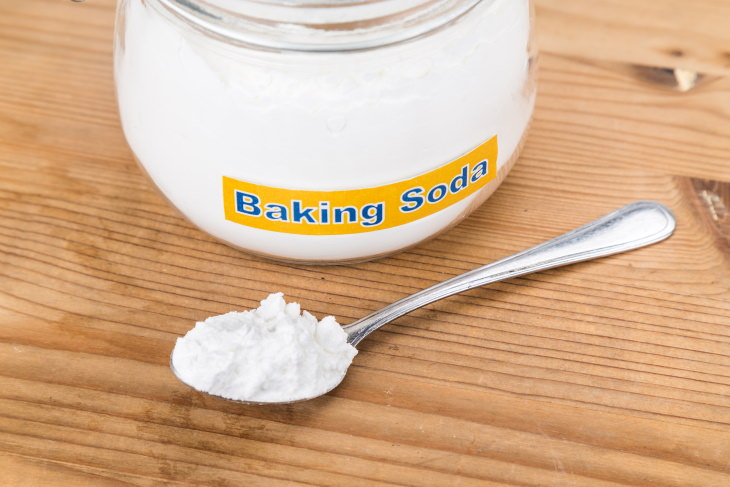 Baking Soda For Laundry jar of baking soda and teaspoon