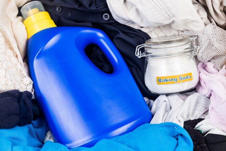 Baking Soda For Laundry detergent and baking soda in a pile of laundry