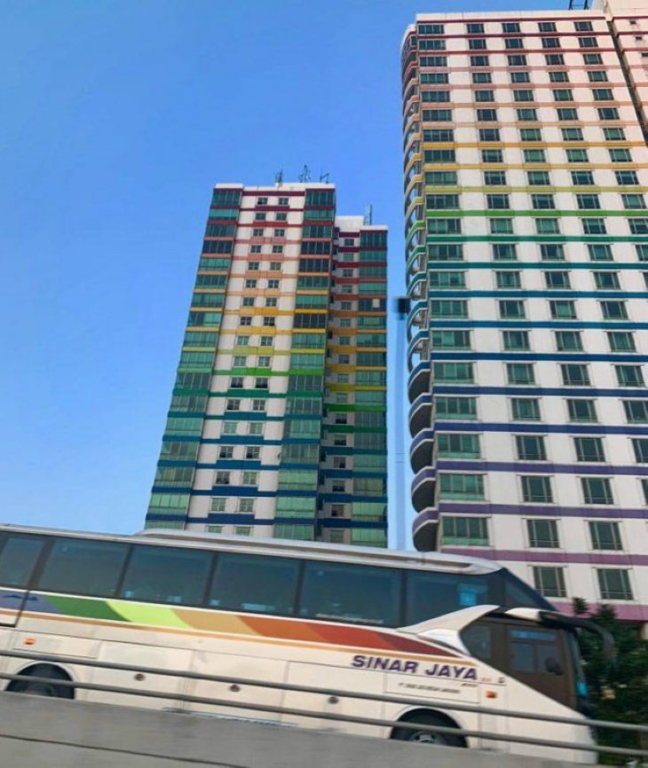 Lucky Coincidences rainbow-colored buildings and bus