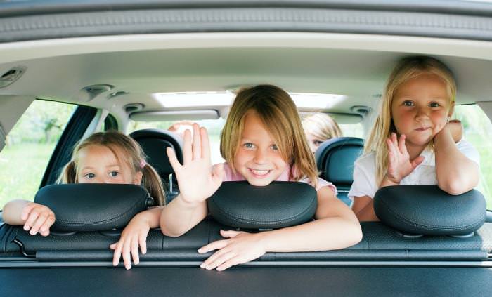 happy kids in backseat