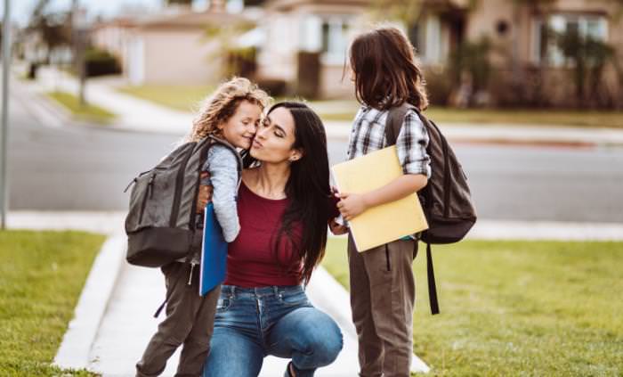 mother picks up children after school