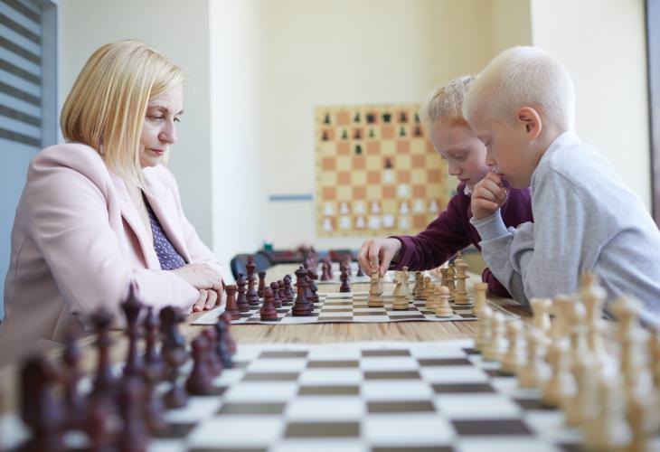 kid and grandma playing chess