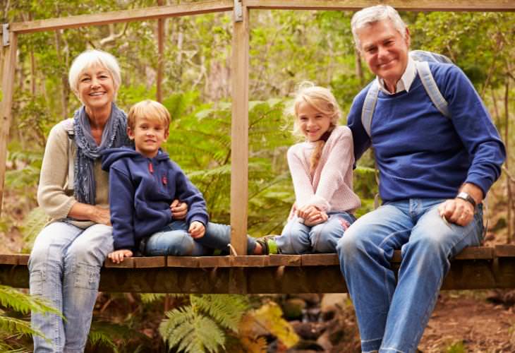 grandparents and grandkids sitting in nature 