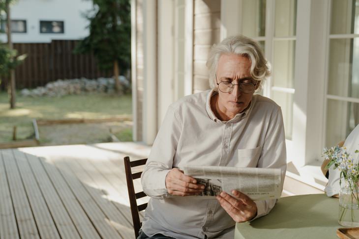 Gray Hair Causes man reading newspaper