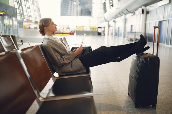Sleep Tips For Travel woman at airport