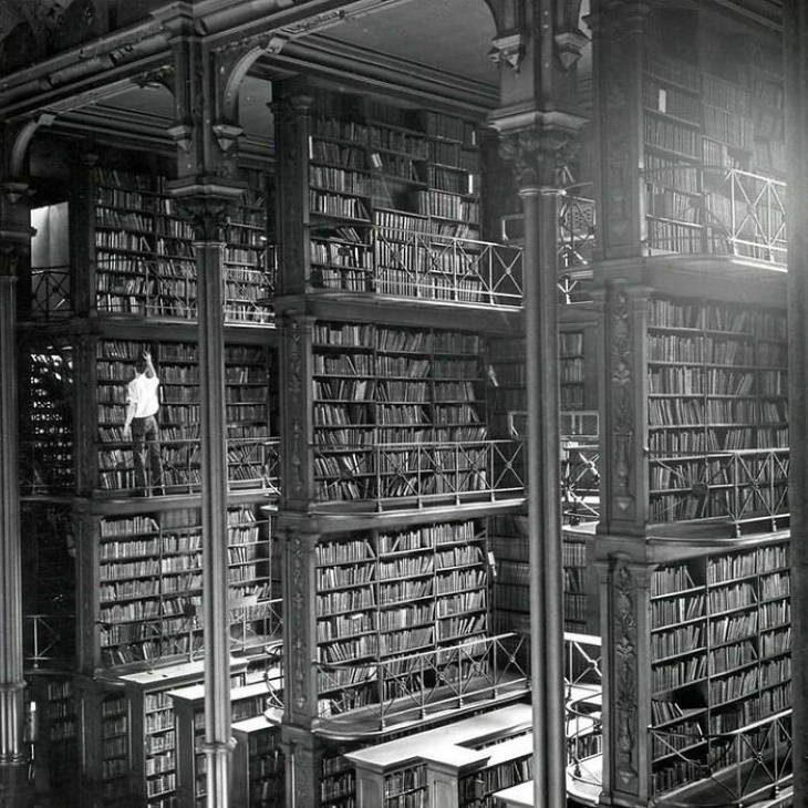 Historical Photos Man searching for books at Public library of Cincinnati