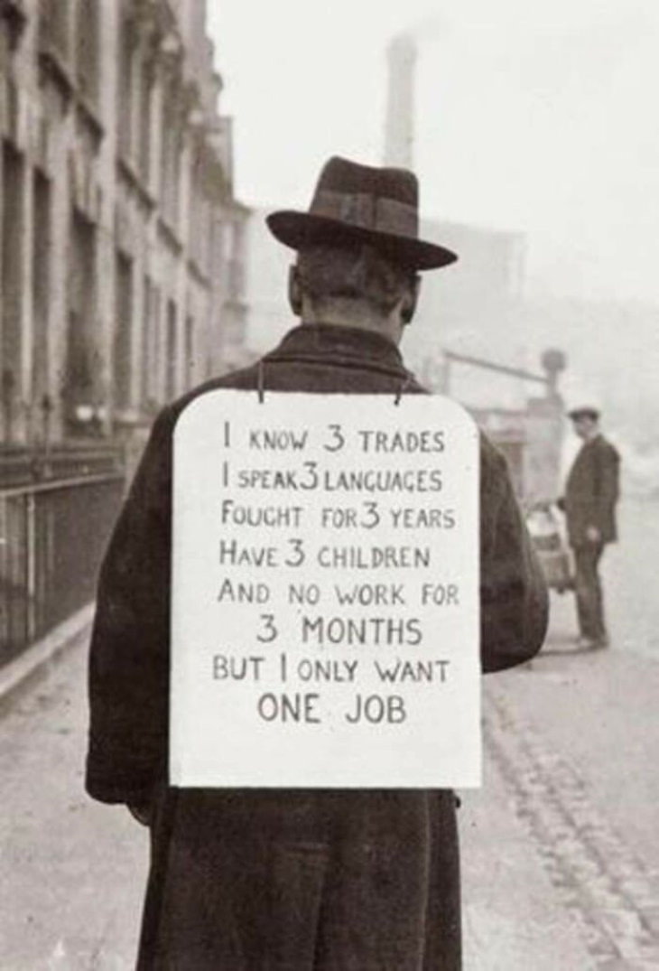 Historical Photos Man searching for a job by wearing his resume in England