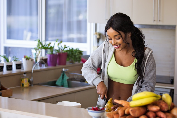 Signs of a Healthy Diet woman preparing food