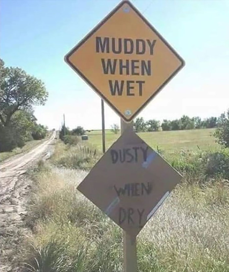 Funny Signs muddy and dusty road