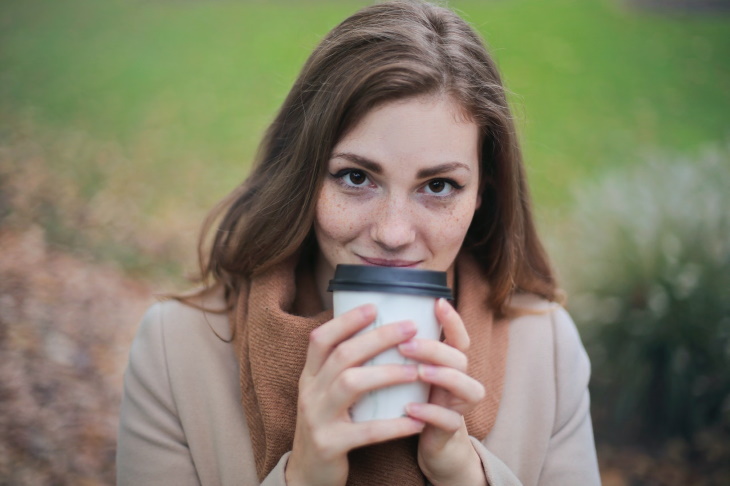 Coffee and Heart Health woman drinking takeaway coffee