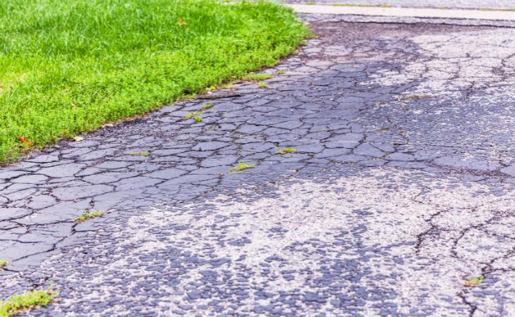 Sealing your driveway - driveway with cracks 