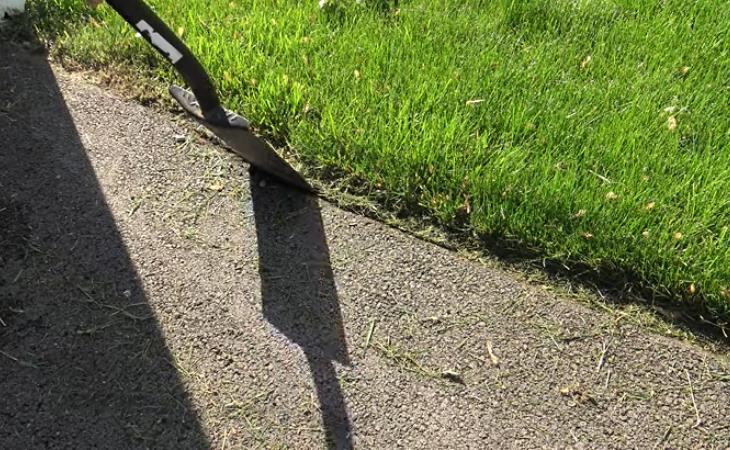 Sealing your driveway - shoveling the driveway edge