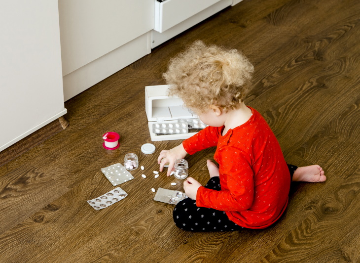 Melatonin Poisoning in Kids child playing with pills
