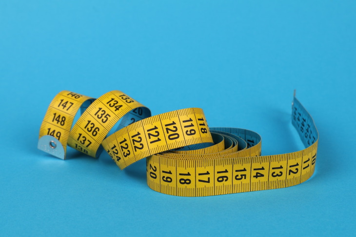 Waist-to-Hip Ratio, measuring tape blue background