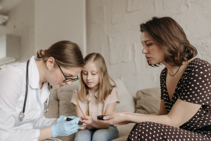 Type 1 Diabetes Preventative Drug doctor doing glucose test for child