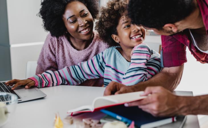 parents do homework with daughter 