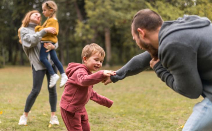 family playing in the yard 