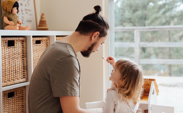 father playing with daughter 