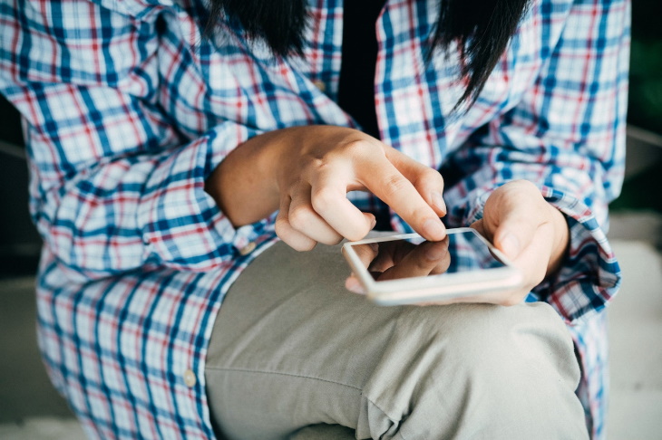 Autocorrect woman browsing on phone