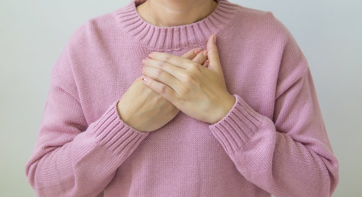 Painful Respiration Causes woman touching chest with hands