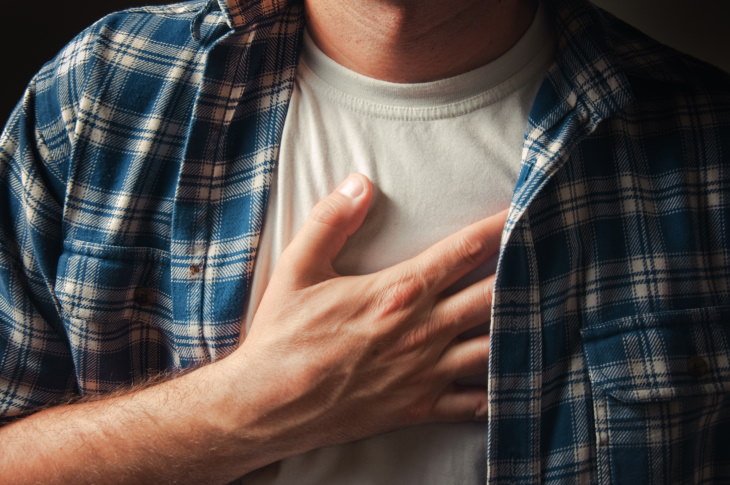 Painful Respiration Causes man holding hand on his chest
