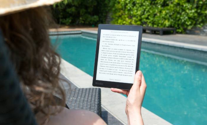 Free e-book, woman reading ebook by the pool