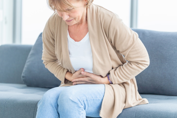 Constipation Myths older woman with a stomachache