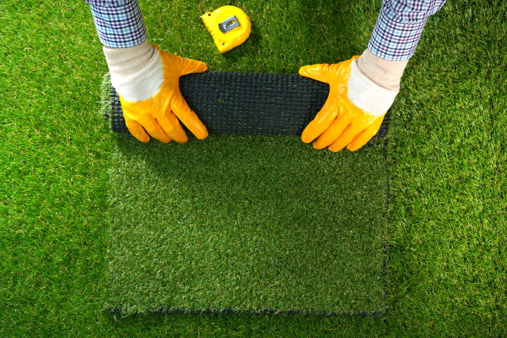 Lawn Care and Maintenance Tips unrolling faux lawn