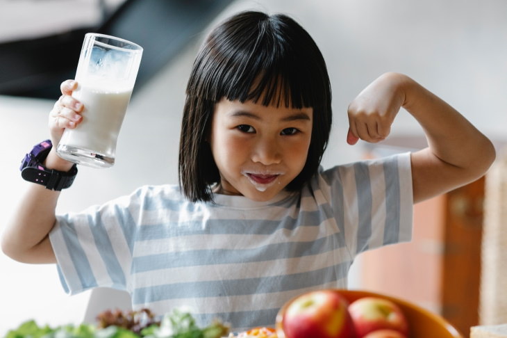 unnecessary supplements girl drinking milk
