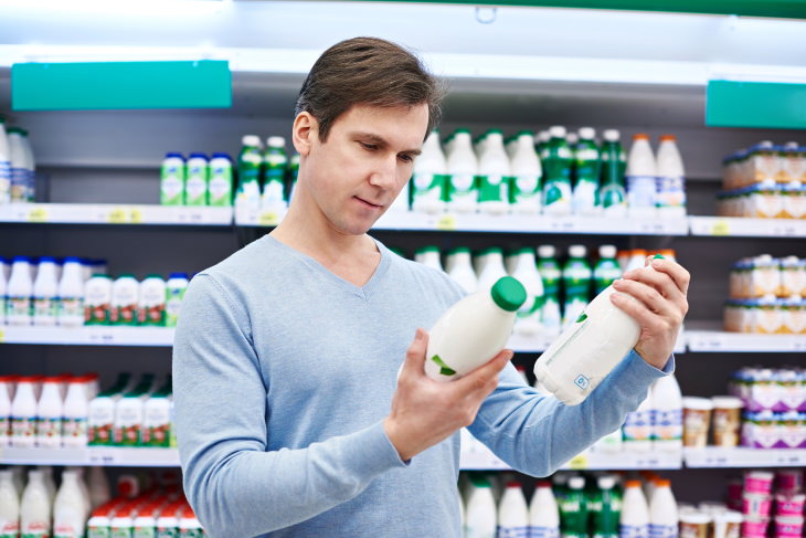 Lactose Intolerance Guide man choosing dairy