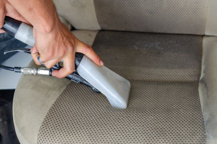 Sunscreen Stain Removal vacuuming car seat