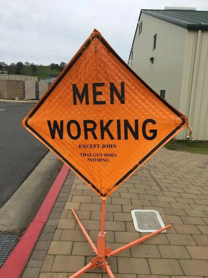 funny sign men working