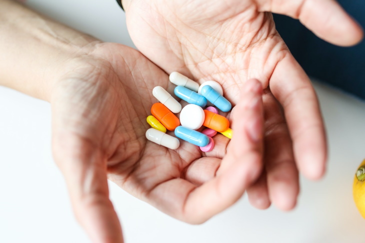 Causes of Hearing Loss pills in hand