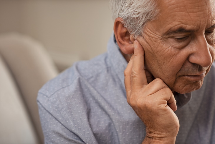 Causes of Hearing Loss older man with ear pain
