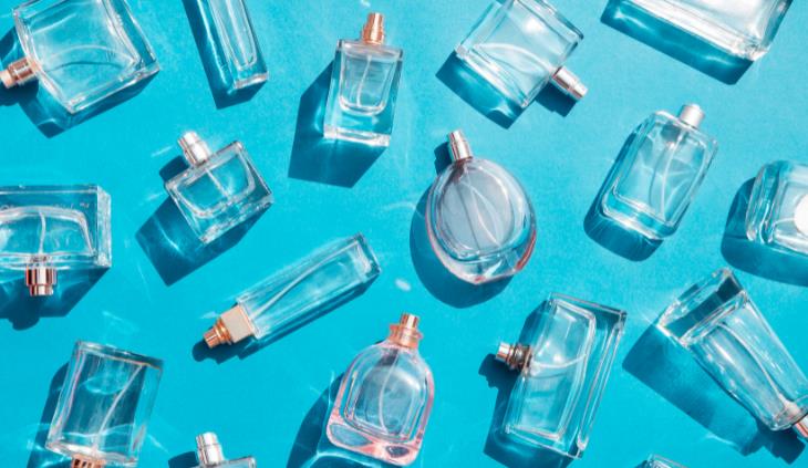 expired perfume - empty bottles blue background