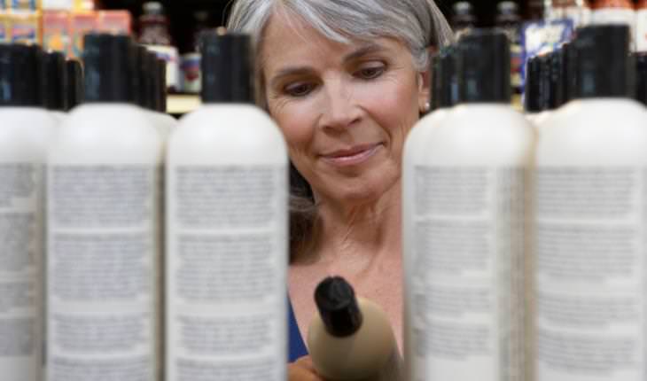 woman reading skincare label