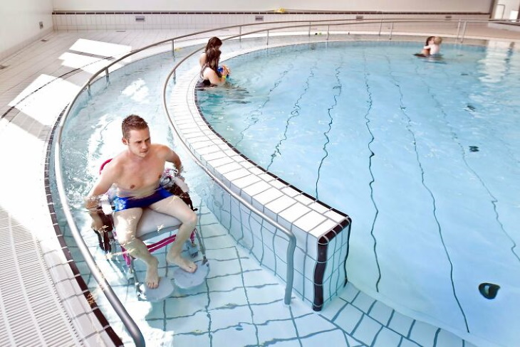 Positive Architecture pool and water slide accessible by wheelchair 
