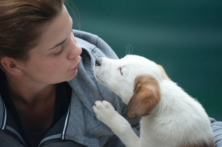 Pet Odors Linked to Medical Issues woman and puppy