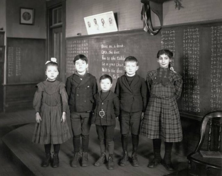 Vintage Photos A group of kids posing in a classroom in the 1900s