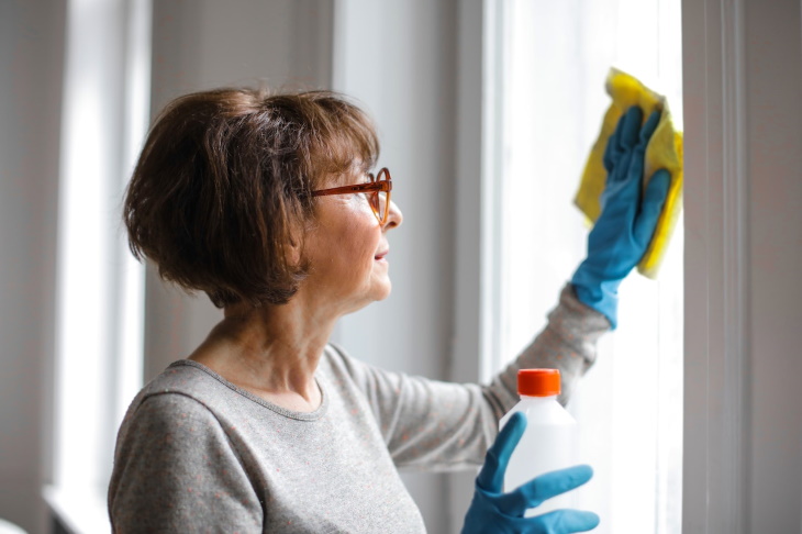 Dementia and Activity Levels woman cleaning windows